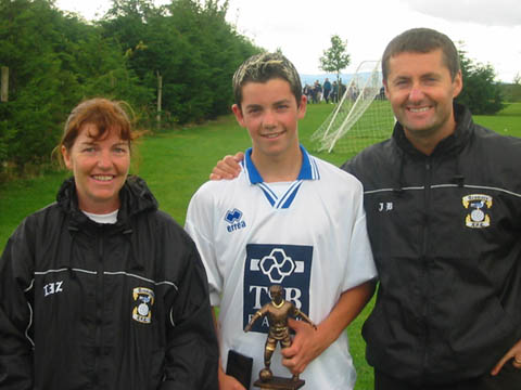 Sean Browne with his man of the match trophy for his performance in the final, pictured with proud parents Liz and John Browne